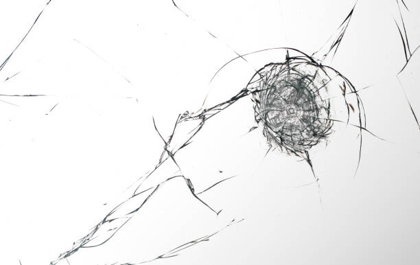 istock Cracks on the glass on a white background. 1319854159