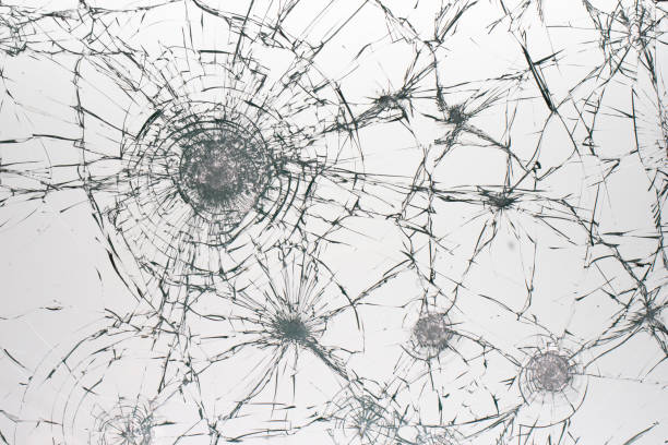 istock Cracks on the glass on a white background. 1319854813