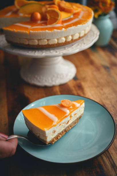 istock Orange Cheesecake with Whipped Cream and White Chocolate 1319855867