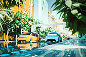 istock Futuristic green city with generic autonomous electric cars 1319855924