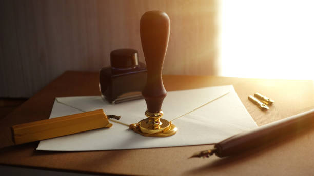 Authentic medieval way to write a letter. Old retro pen dipped in special ink. Concept of writing a letter, invitation in the past and history.
