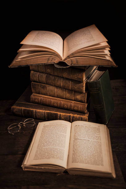 istock Stack of Antique Hardcover Books with Eyeglasses 1319858521