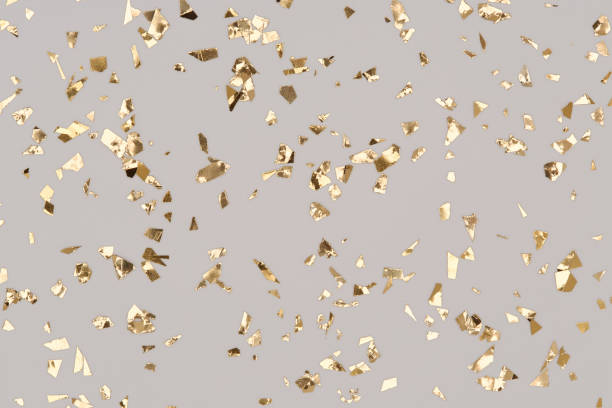 istock Gold confetti sparkles on grey background, golden chic holiday backdrop. 1319858742