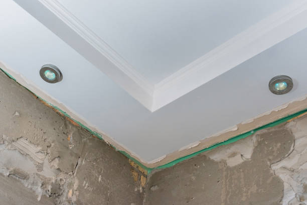 istock Details of the corner ceiling, with ceiling lights. Apartment renovation 1319858793