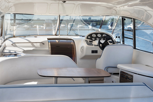 Luxury yacht control wheel and interior of a transport motorboat