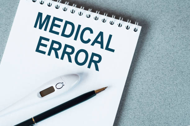 istock Medical error text. Written on white paper on your desktop. Medical concept. 1319859972