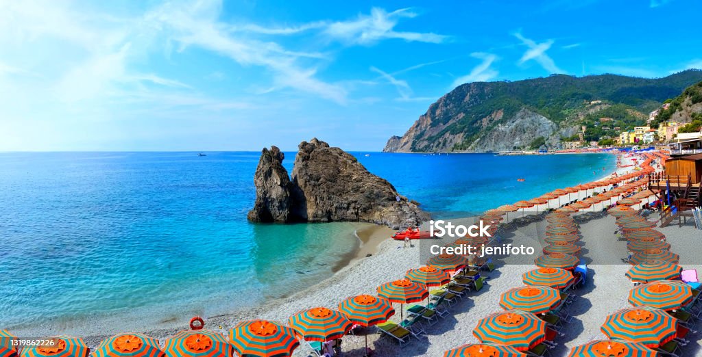 Panoramic view over colorful umbrellas at a beach in the Cinque Terre, Italy Panoramic view over colorful umbrellas at a beach in the Cinque Terre village of Monterosso, Italy Monterosso Stock Photo