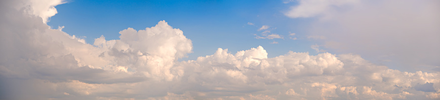 Close-up view of a cumulus cloud with very sinuous features, dislocating little by little