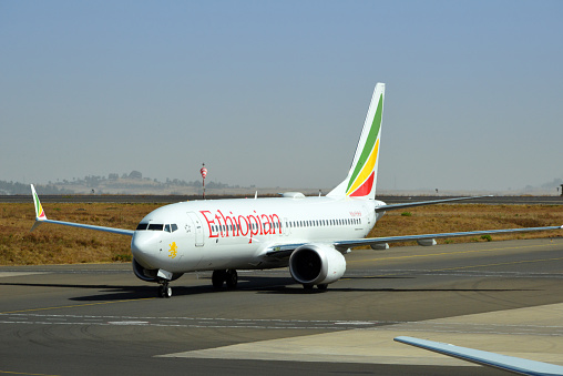 Addis Ababa, Ethiopia: Ethiopian Airlines ET-AVI (Boeing 737 NG / Max - MSN 62448), twin of the Ethiopian 737 MAX ET-AVJ that crashed on 10 March 2019 (Flight 302) - taxiing at Addis Ababa Bole International Airport (IATA: ADD, ICAO: HAAB) - the Boeing 737 MAX has presented numerous quality issues that were not adequately addressed by Boeing or supervised by the Federal Aviation Administration, leading to two fatal crashes, Lion Air Flight 610 and Ethiopian Airlines Flight 302.