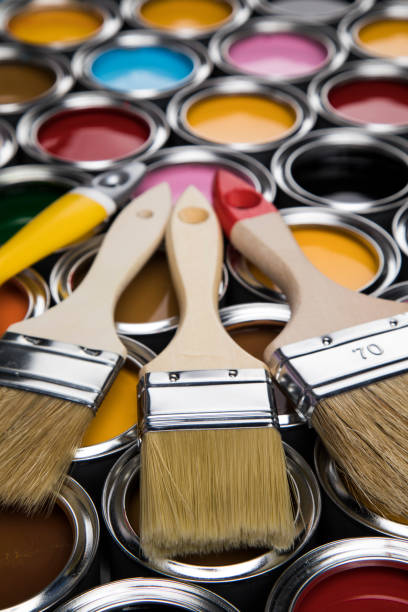 istock Paintbrush on cans with color 1319868994