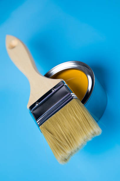 istock Colorful paint cans with paintbrush 1319869739