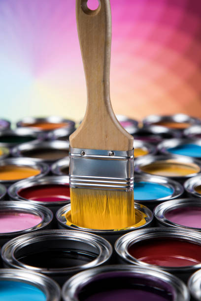 istock Open paint cans with a brush, Rainbow colors 1319869919