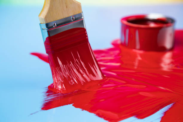 istock Paintbrush on cans with color 1319870855
