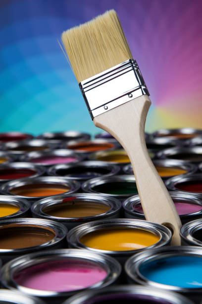 istock Open paint cans with a brush, Rainbow colors 1319870867