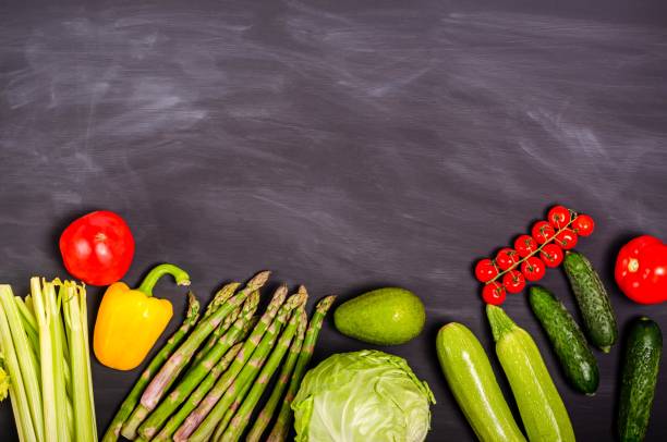 istock Fresh vegetables with place for text on a black background. 1319872448