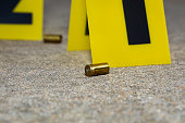 Gun shell casing at crime scene. Gun violence, mass shooting and homicide investigation concept.