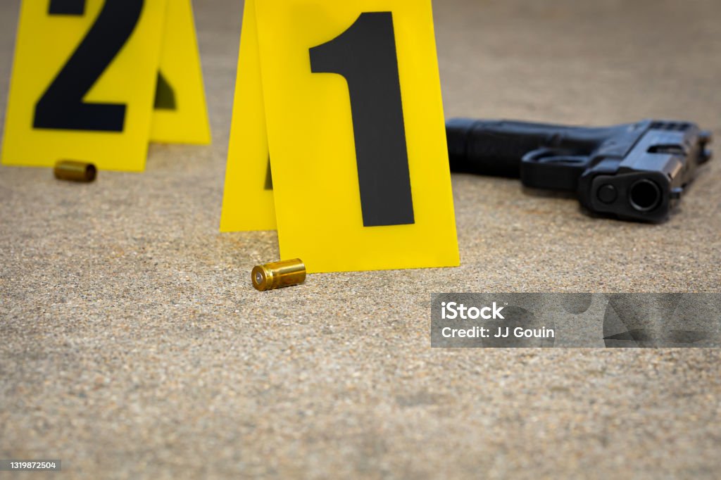 Gun shell casing at crime scene. Gun violence, mass shooting and homicide investigation concept. background, no people Crime Scene Stock Photo