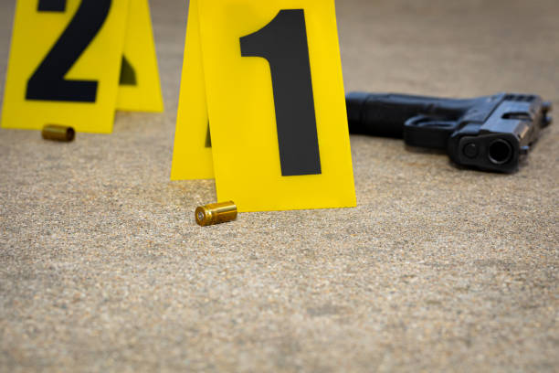 Gun shell casing at crime scene. Gun violence, mass shooting and homicide investigation concept. background, no people gang photos stock pictures, royalty-free photos & images