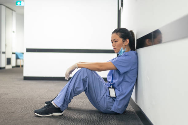 istock Overworked nurse takes a break during the pandemic 1319877926