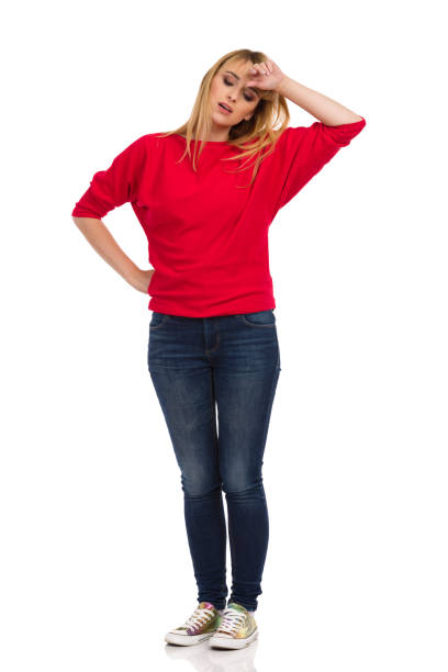 istock Tired Woman Is Standing ANd Holding Hand On Forehead. 1319879061
