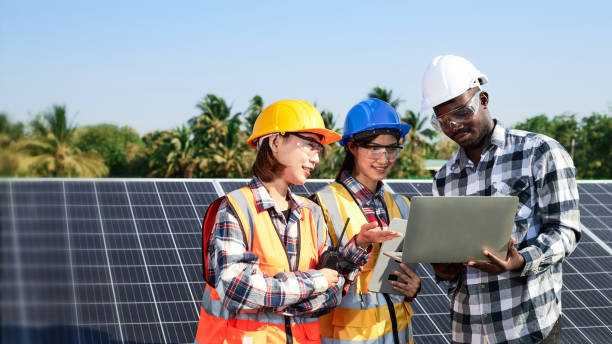 istock A group of electrical engineers is working outdoors in the Solar panel installation area. 1319880219