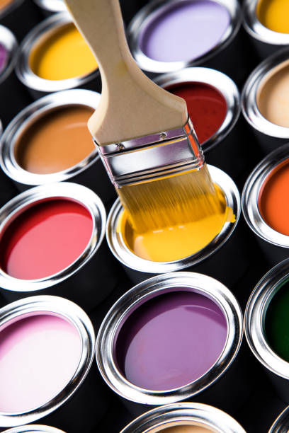 istock Paintbrush on cans with color 1319883795