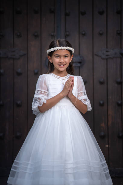 istock First Communion latin girl 1319886443