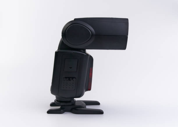 istock Handheld flash for photographic camera on a white background 1319888930