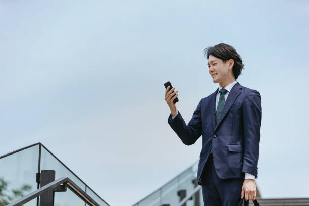 istock Image of IoT | A man who operates home appliances from his commute 1319889543