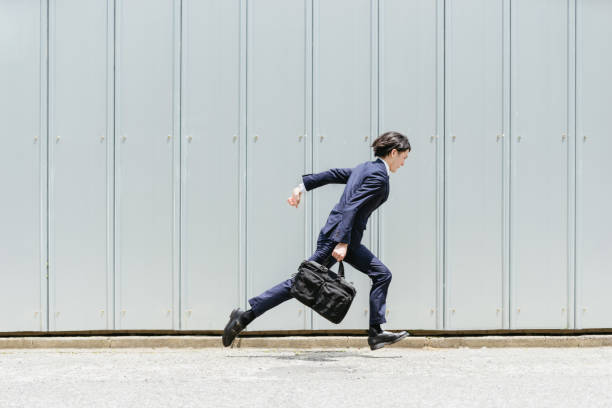 istock Image of a business with a young businessman speed running 1319889607