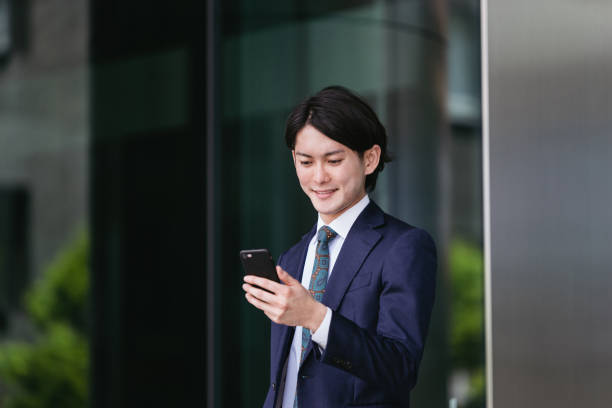 istock Young men coming to work ・ IoT / business image with smartphones 1319889645