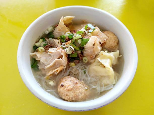 Bakso or Bakwan Malang, Meatball Soup with various side dish like tofu, Noodles, fried shiumay, or bakso goreng and leek.