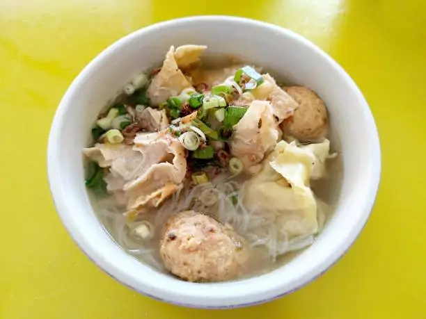 Bakso or Bakwan Malang, Meatball Soup with various side dish like tofu, Noodles, fried shiumay, or bakso goreng and leek.