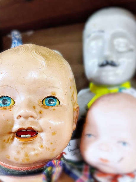 istock Creepy old doll heads 1319894555