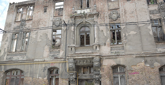 Decaying facade of an old residential building in Sarajevo