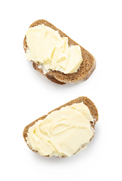 istock butter with bread isolated white background, two sides 1319900355