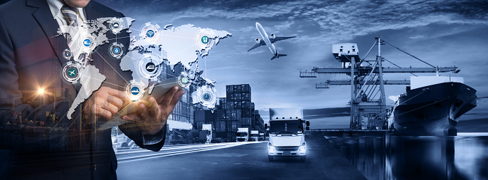 Multiple exposures of Businessman touching tablet for analyze stock at logistics port and world map with logistic network distribution on background, transportation trading business concept,