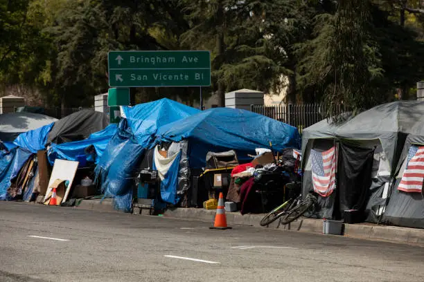 A homeless encampment sits on a street in Downtown Los Angeles, California, USA.