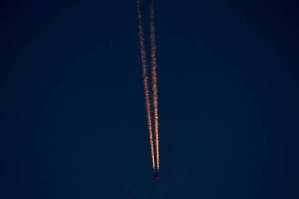istock Jet contrails in the westerly sky after sunset 1319903227