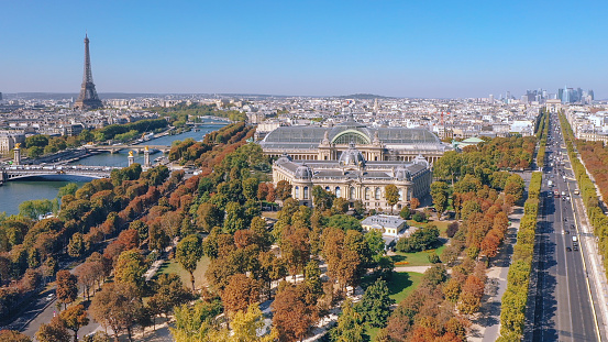 Aerial view of Paris with Grand and Petit Palais and Montmartre in background in the evening