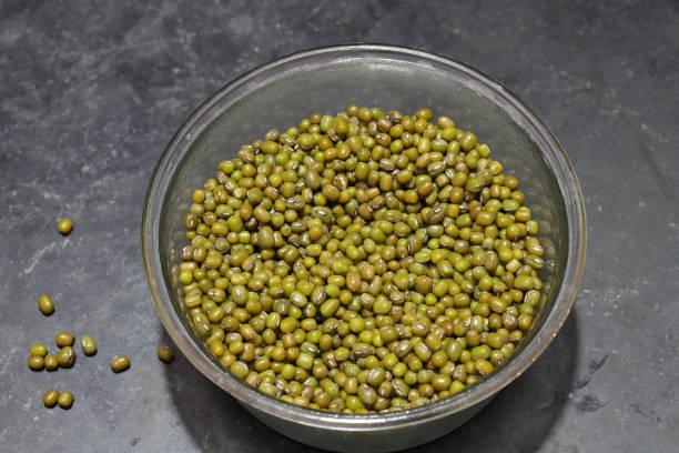 istock Fresh green gram beans in white background 1319909321