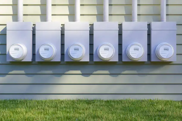 Photo of Front View Of Electric Meters On Building Facade