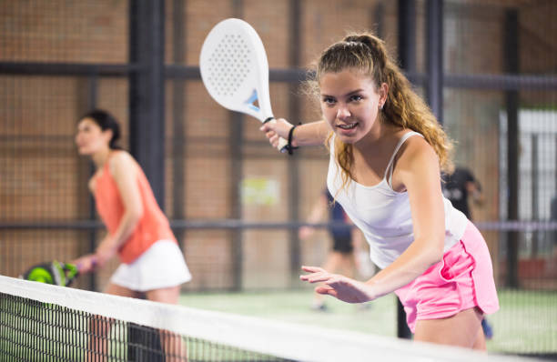 istock Young beautiful woman with racket playing padel 1319911915