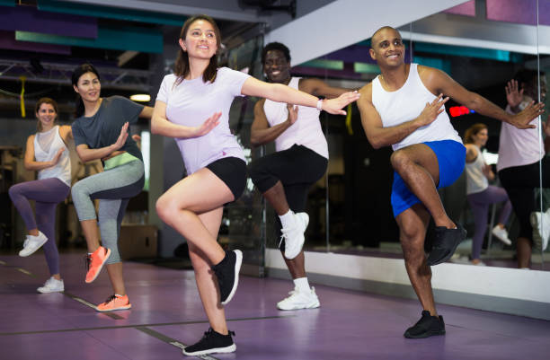 istock People dancing aerobics at lesson in gym 1319913282