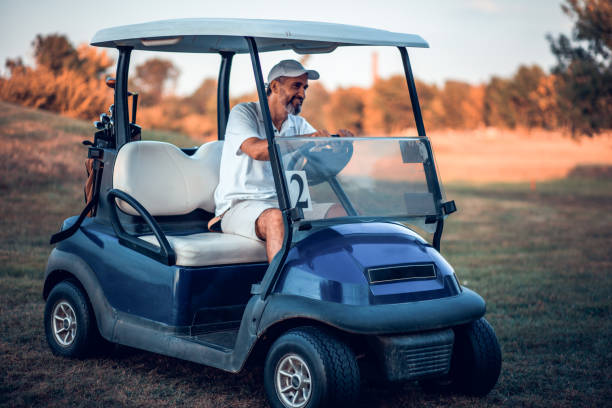 istock Happy Senior man in golf car. 1319915331