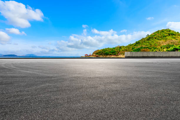 istock Asphalt road and beautiful seaside scenery under blue sky. 1319916770