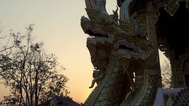 Naga Statue at the sunset in Thai Buddhist Temple (Wat Phra That Doi Kham) Chiangmai, Thailand.