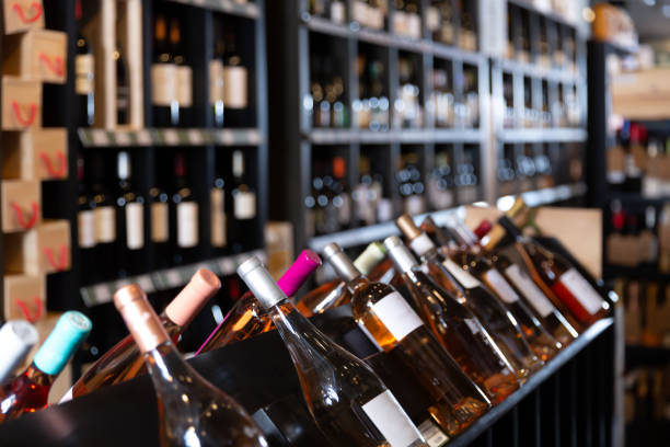 istock Red and white wine bottles waiting for customers 1319920300