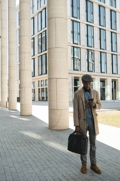 istock Businessman using phone outdoors 1319920618