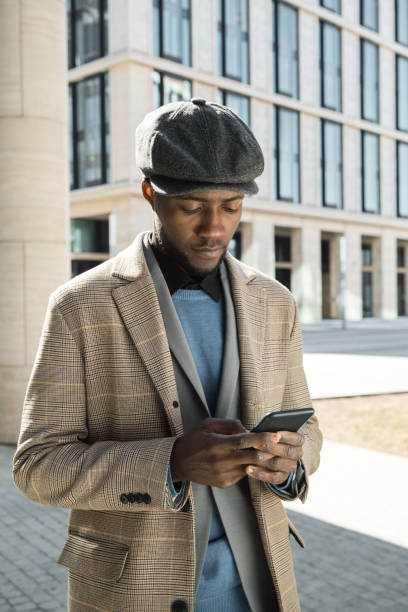 istock Man with phone in the city 1319920707